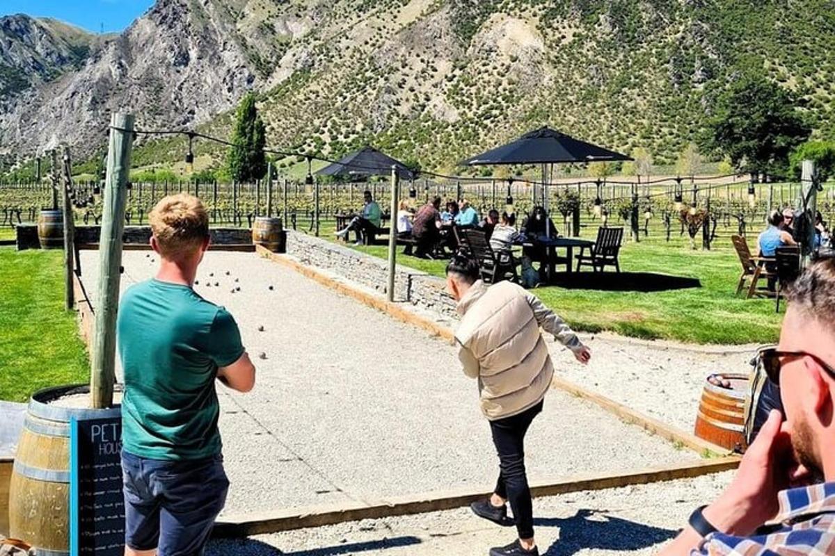 a group of people playing baseball in a park