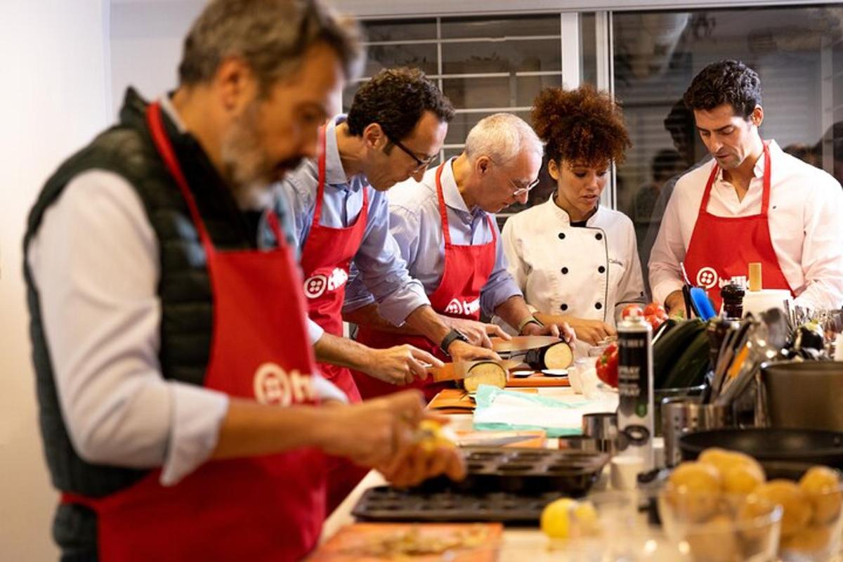 a group of people in a kitchen preparing food