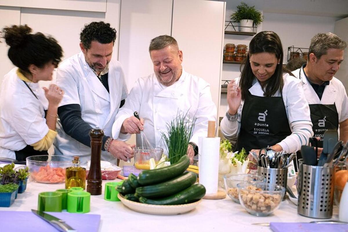 a group of chefs preparing food in a kitchen