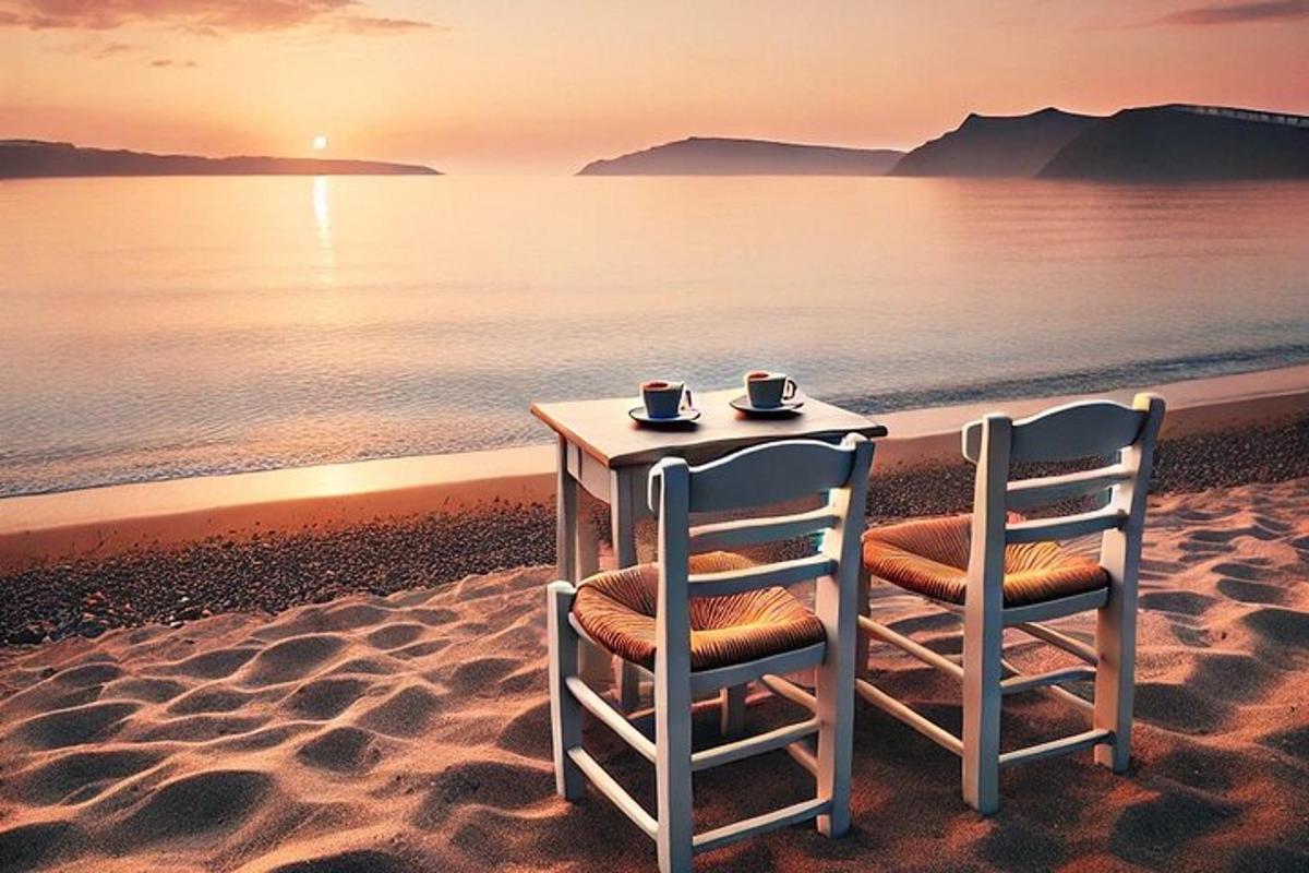 een tafel en stoelen op het strand met de zonsondergang