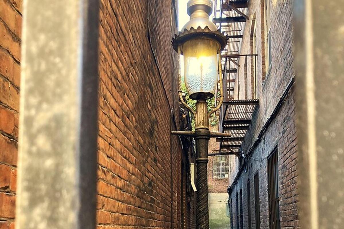 a street light on the side of a brick building
