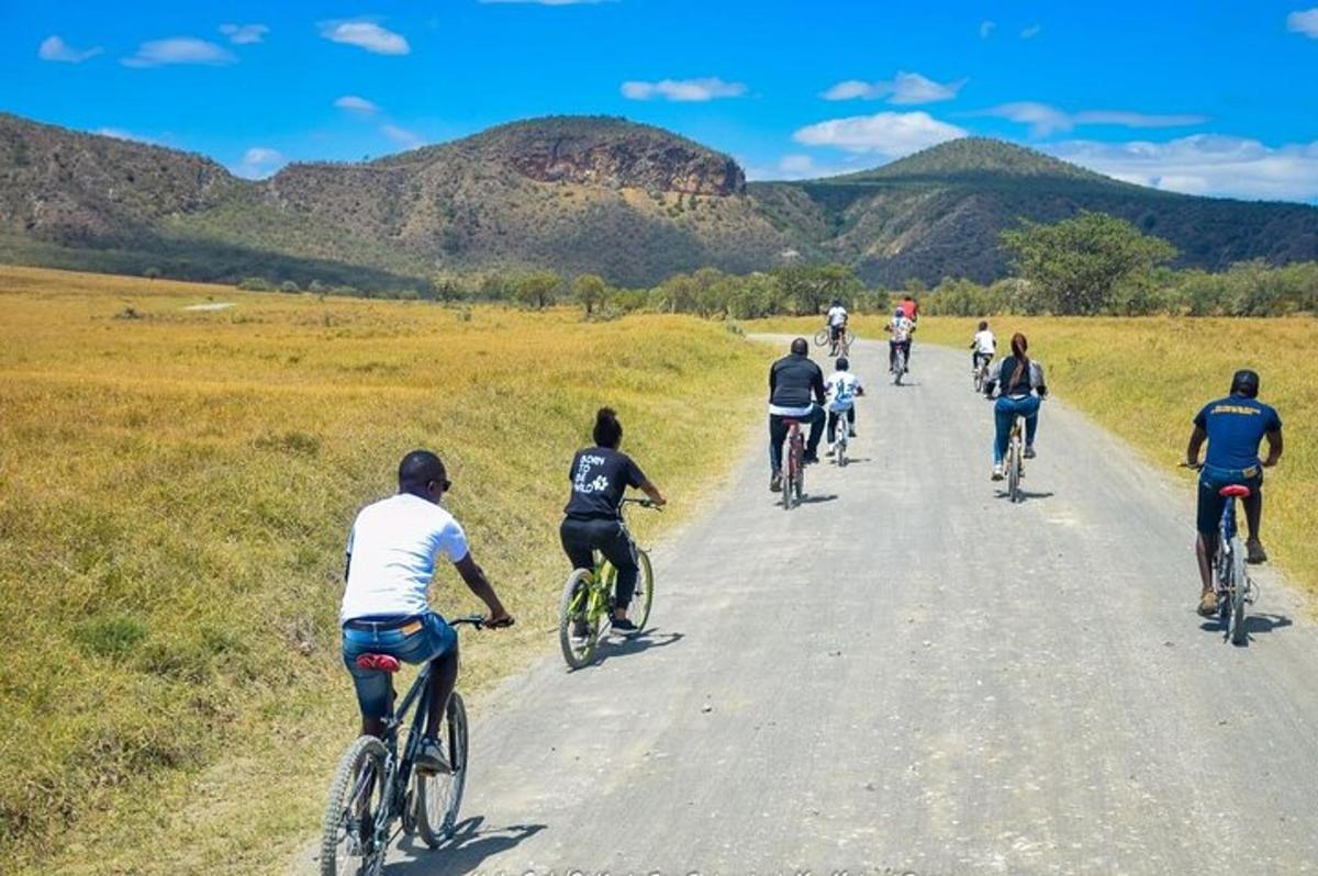 a group of people riding bikes down a road