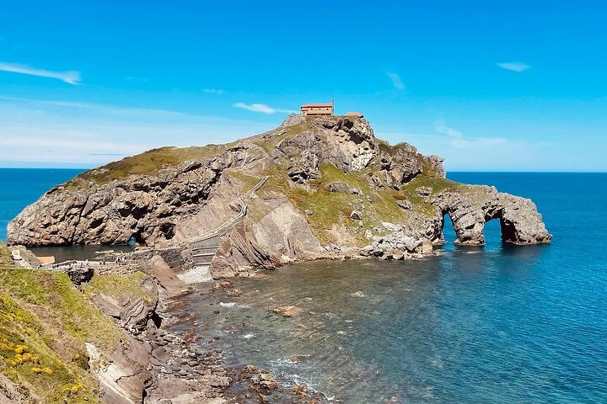 a small house on top of a small island in the ocean