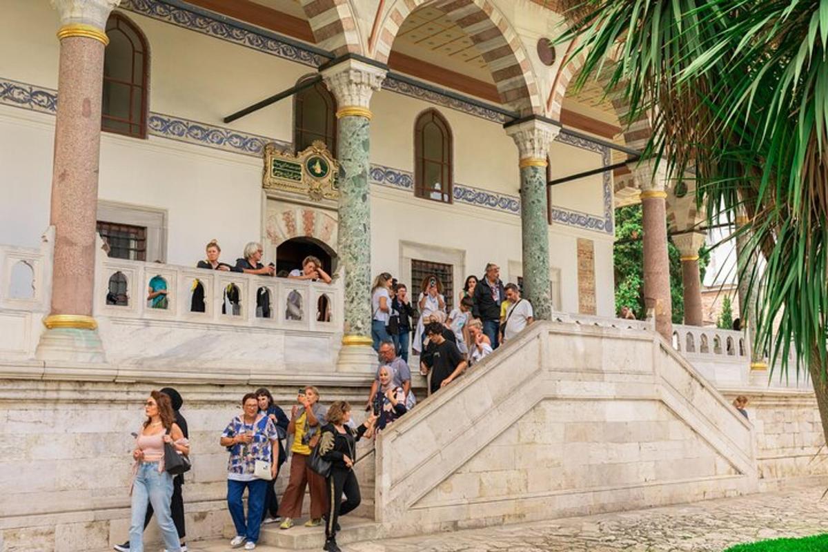 a group of people walking up the stairs of a building