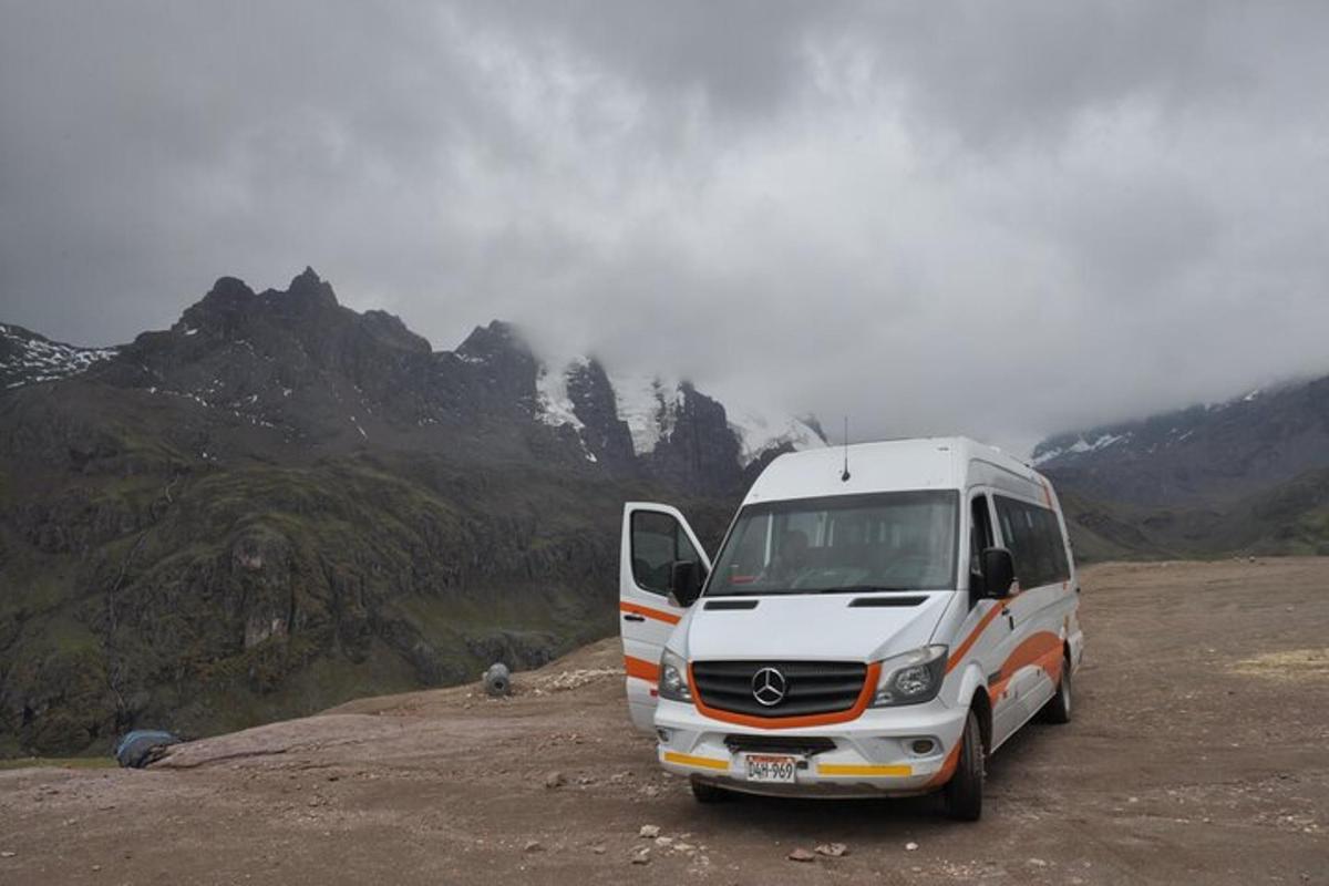a white van parked on the side of a mountain