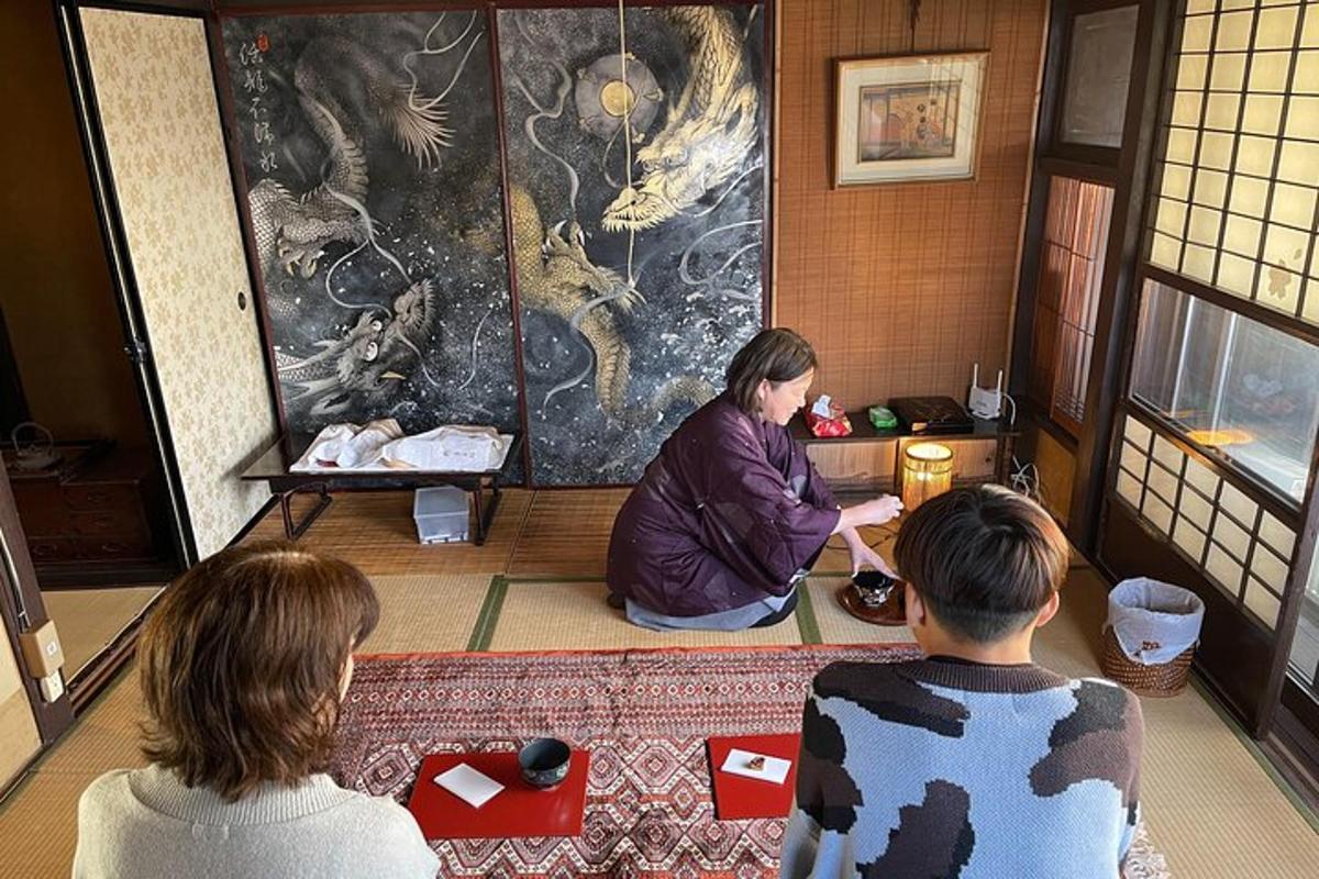 three people sitting on the floor in a room