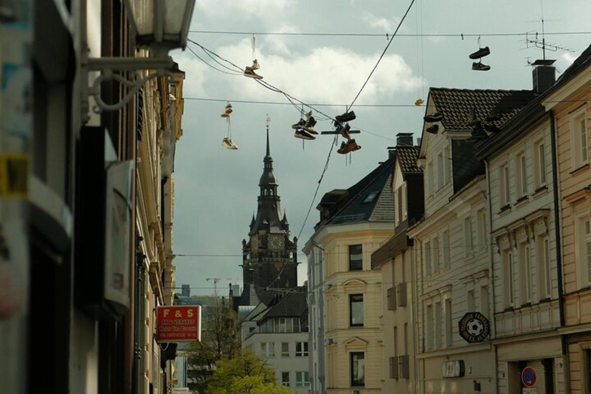 a city street with shoes hanging from wires