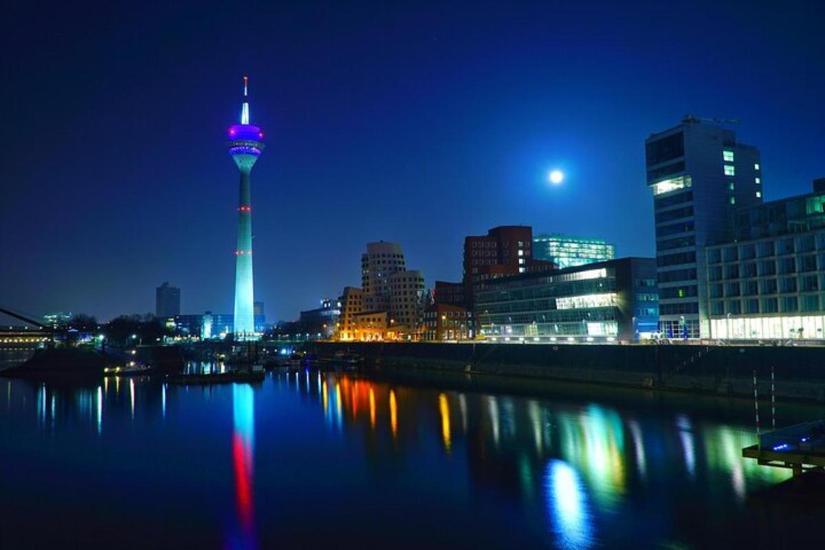 a view of a city at night with a tower