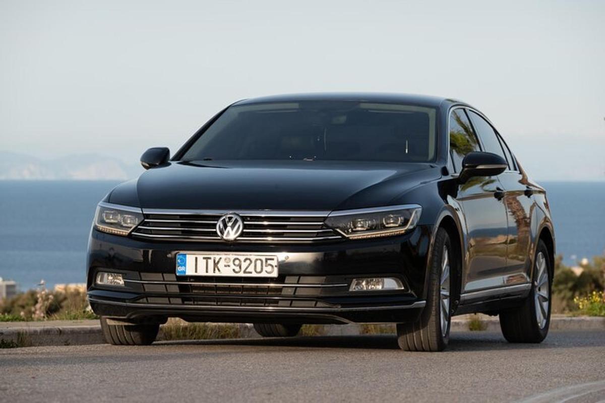 a black car parked on the side of a road