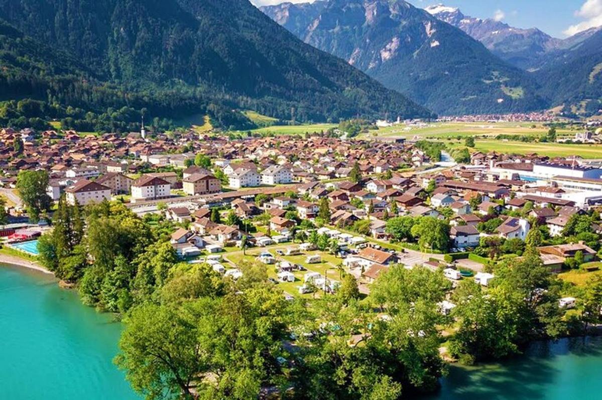 an aerial view of a town next to a river