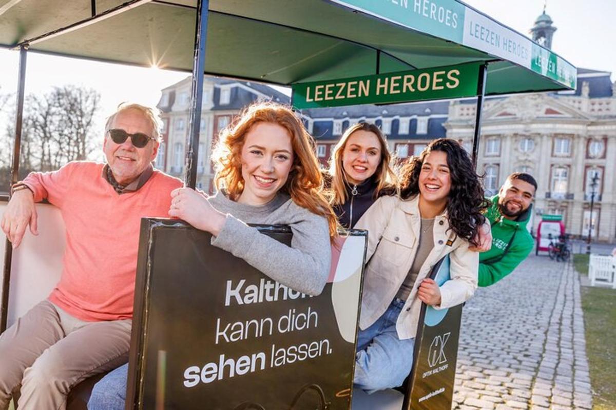 a group of people sitting at a bus stop
