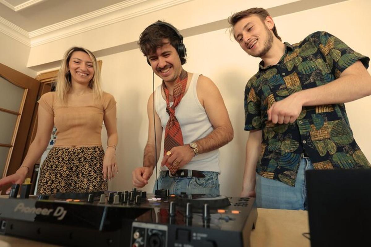 a group of three people standing next to a table