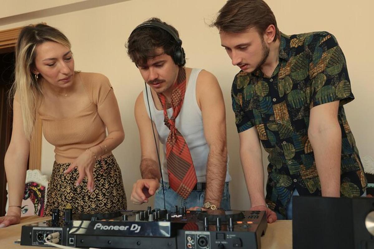 a group of three people looking at a camera