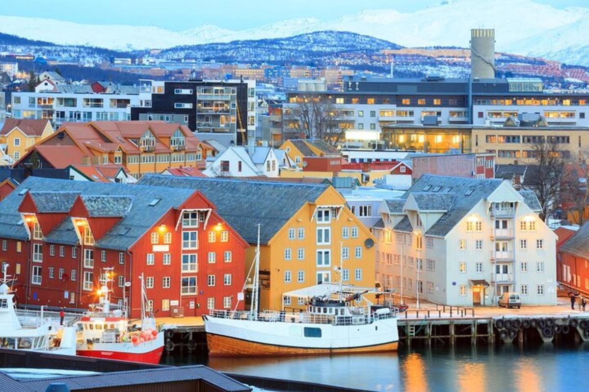 a city with buildings and boats in the water