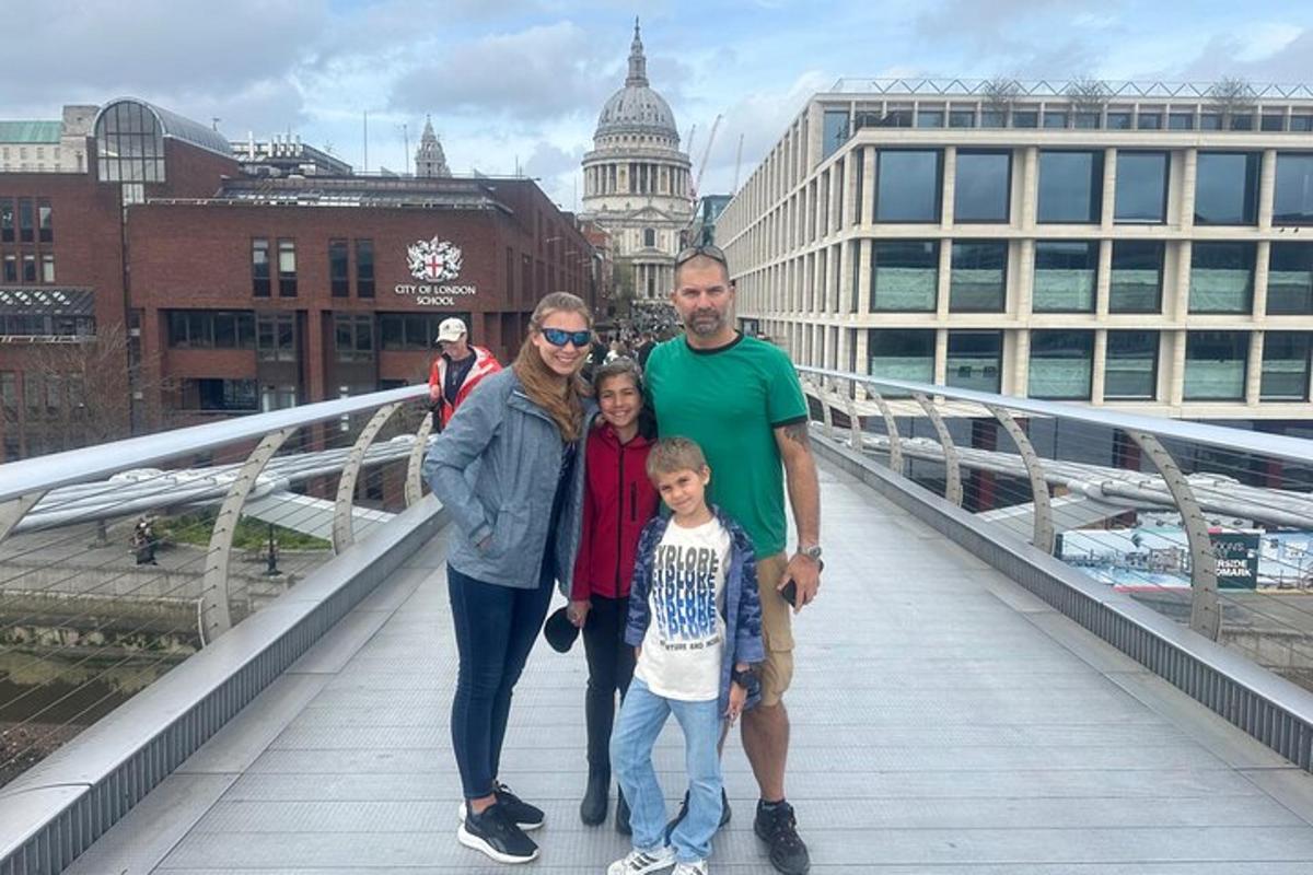 a family posing for a picture on a bridge