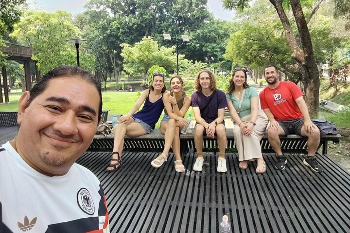 a group of people sitting on a picnic table
