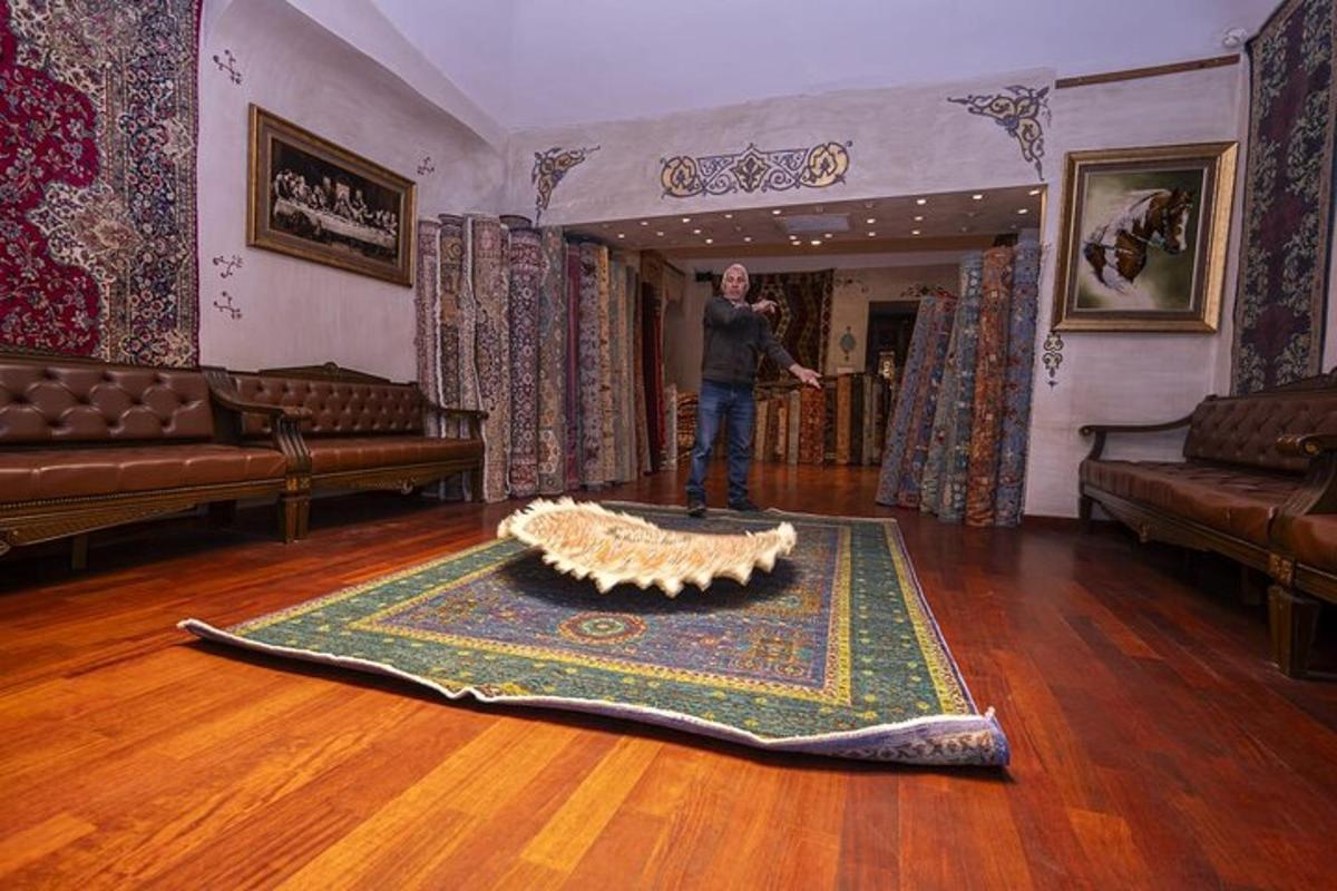 a man standing in a room with a rug on the floor