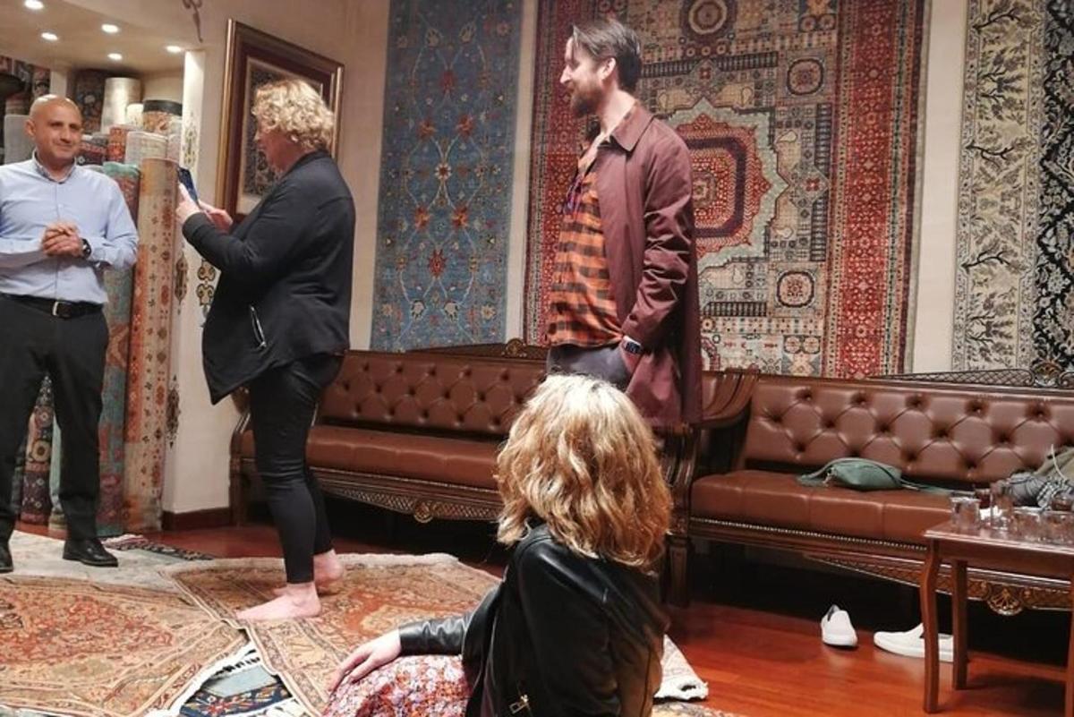 a group of people standing in a living room