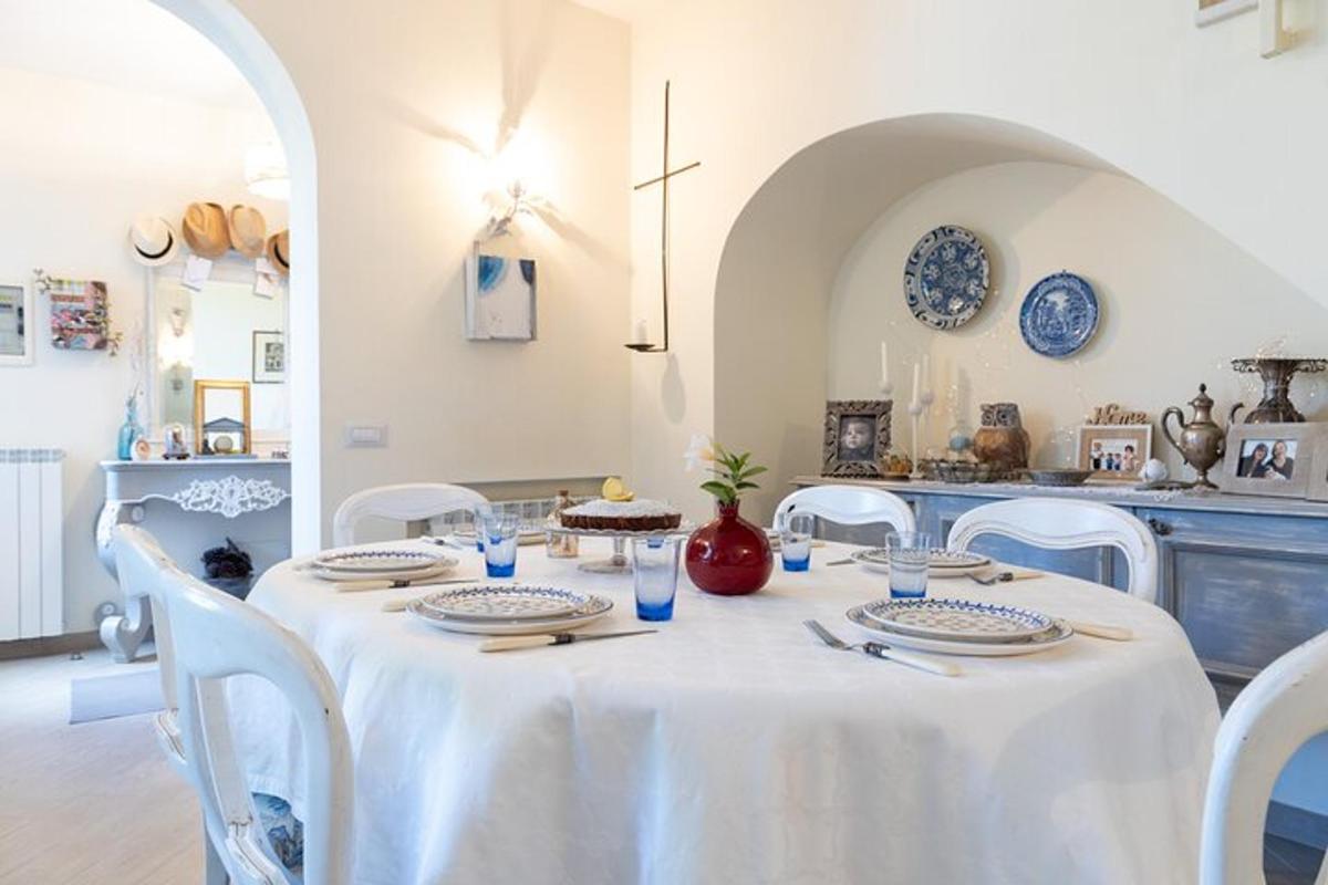 a table with a white table cloth and plates on it