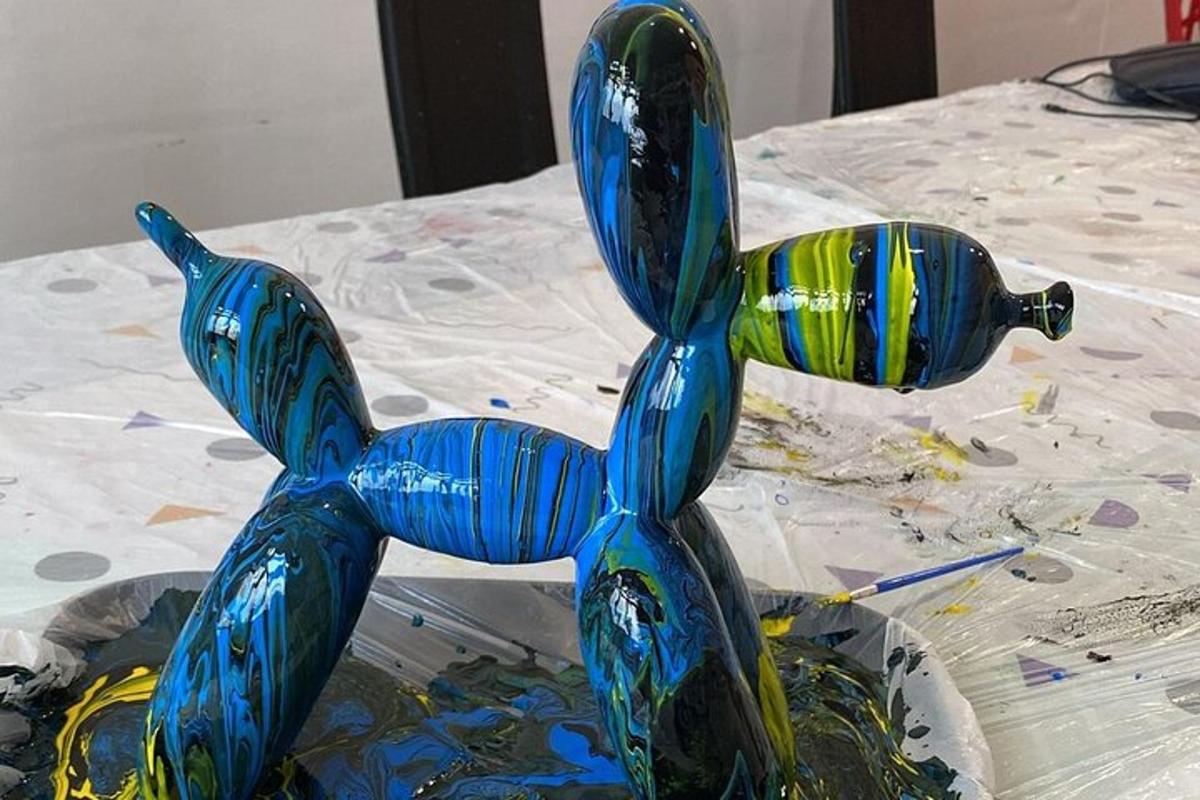 a glass sculpture of three birds on a table