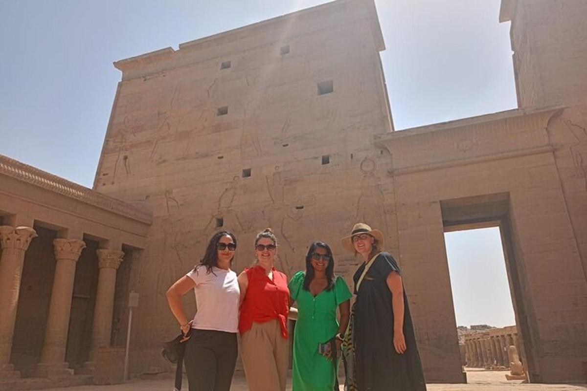 a group of women standing in front of a building