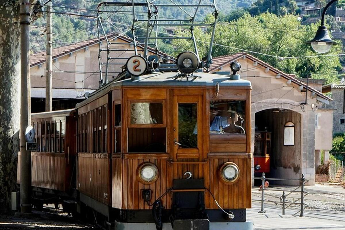 an old trolley car is sitting on the tracks