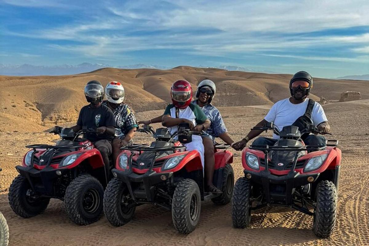 a group of people riding atvs in the desert