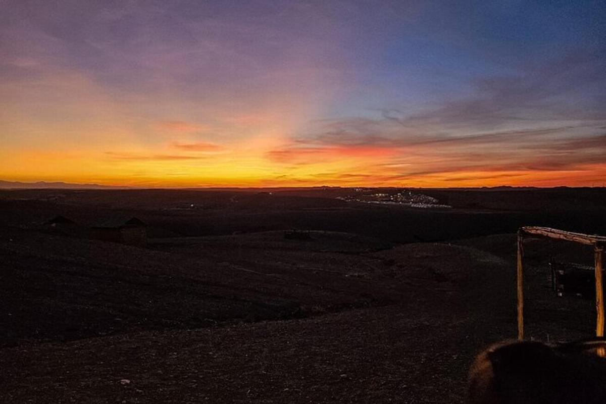 a sunset from the top of a hill