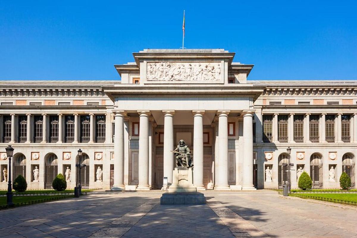 a large building with a statue in front of it