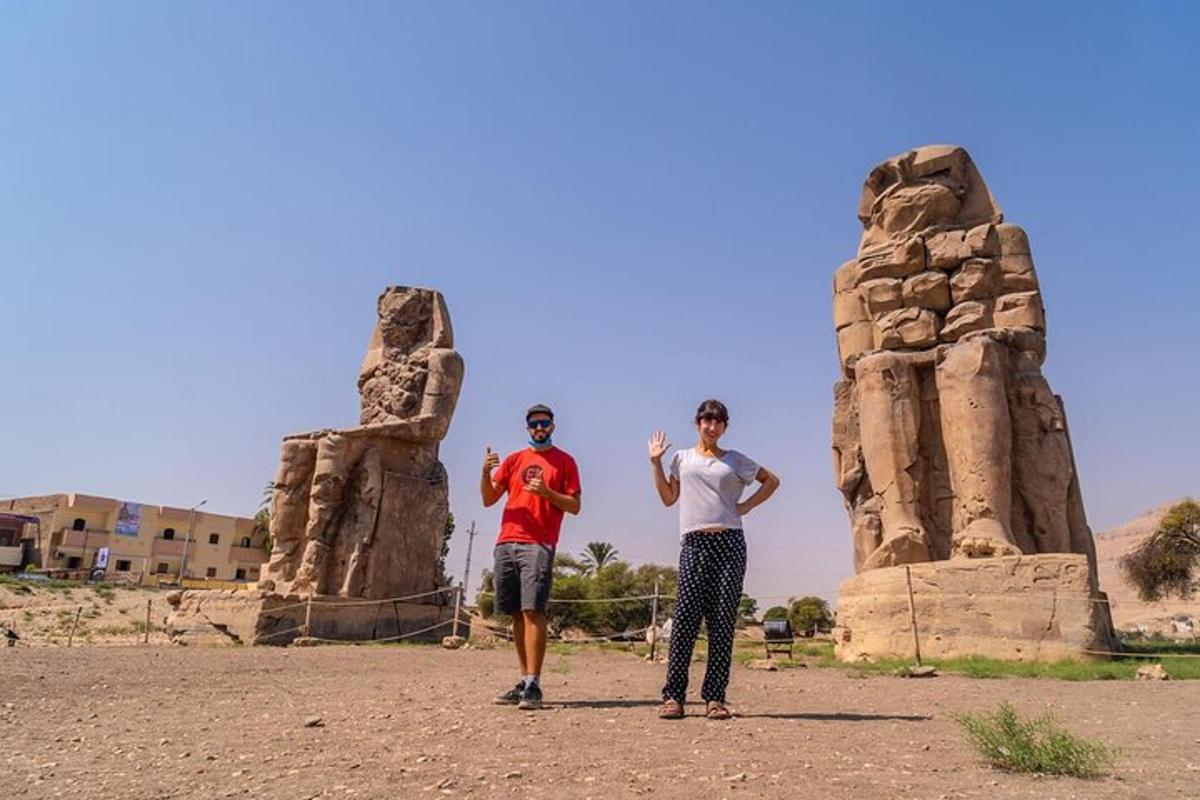 two men standing in front of a rock formation