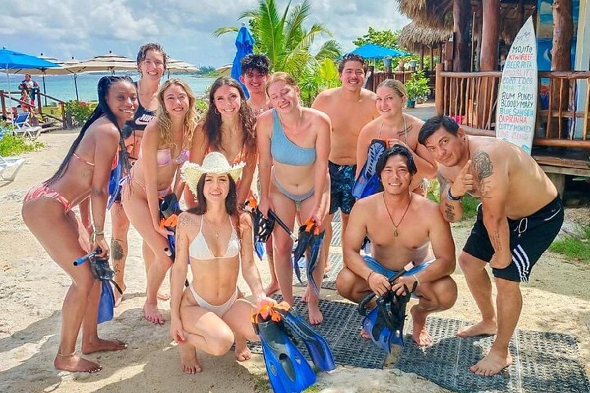 a group of people posing for a picture on the beach