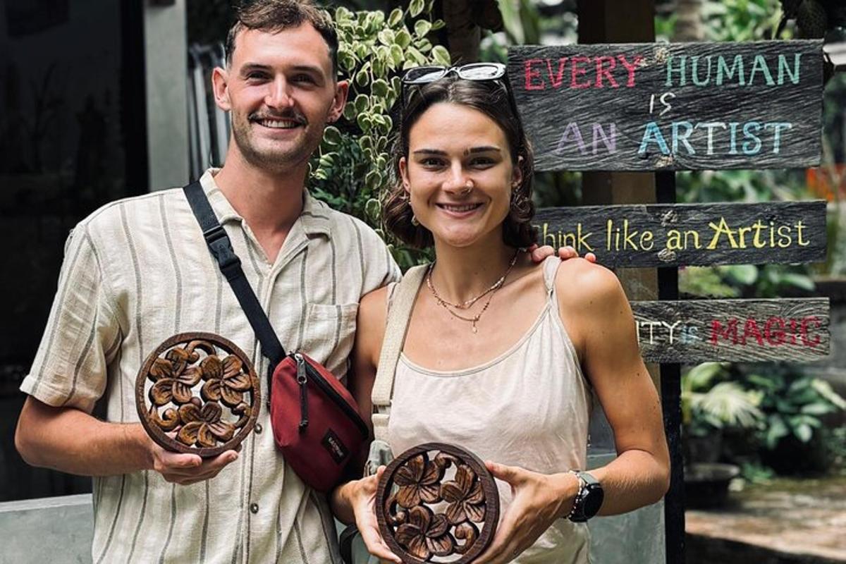 a man and a woman holding donuts in front of a sign