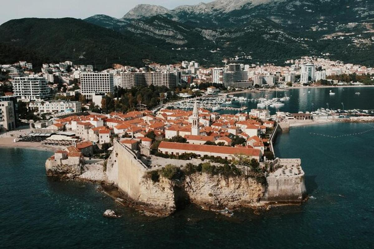 an aerial view of a city on the water
