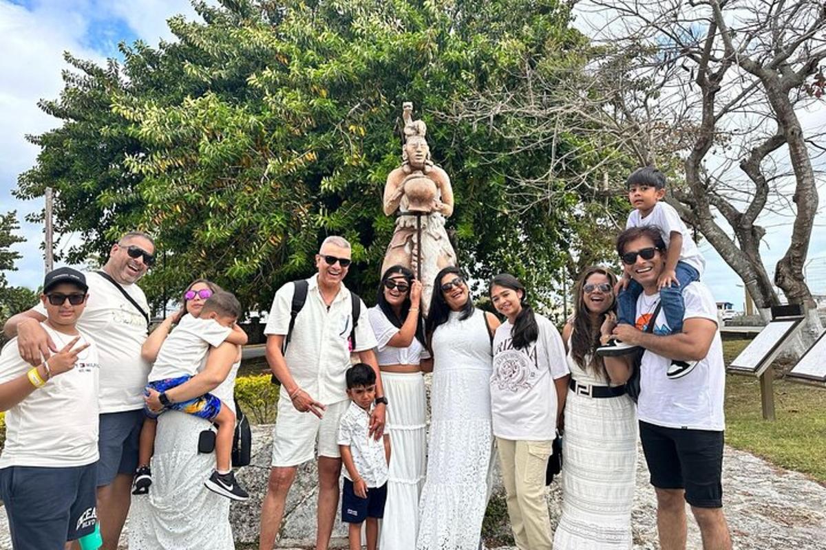 a group of people standing in front of a statue