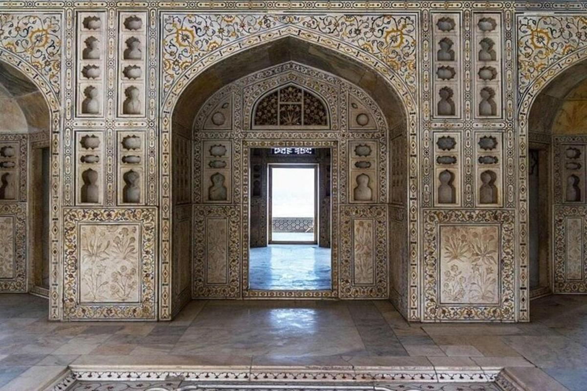 an ornate room with an archway in a building