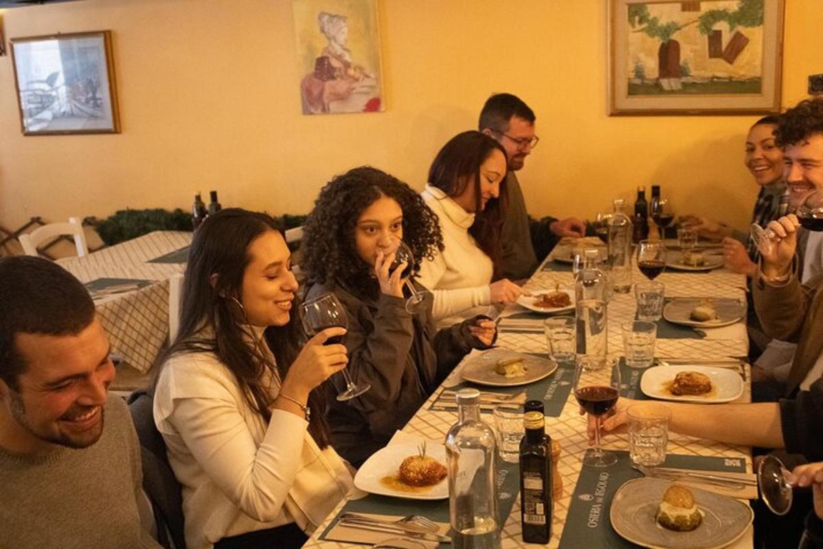 a group of people sitting at a table eating