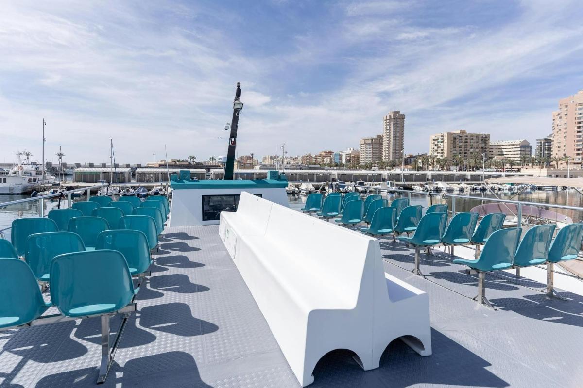 a row of chairs on the roof of a boat