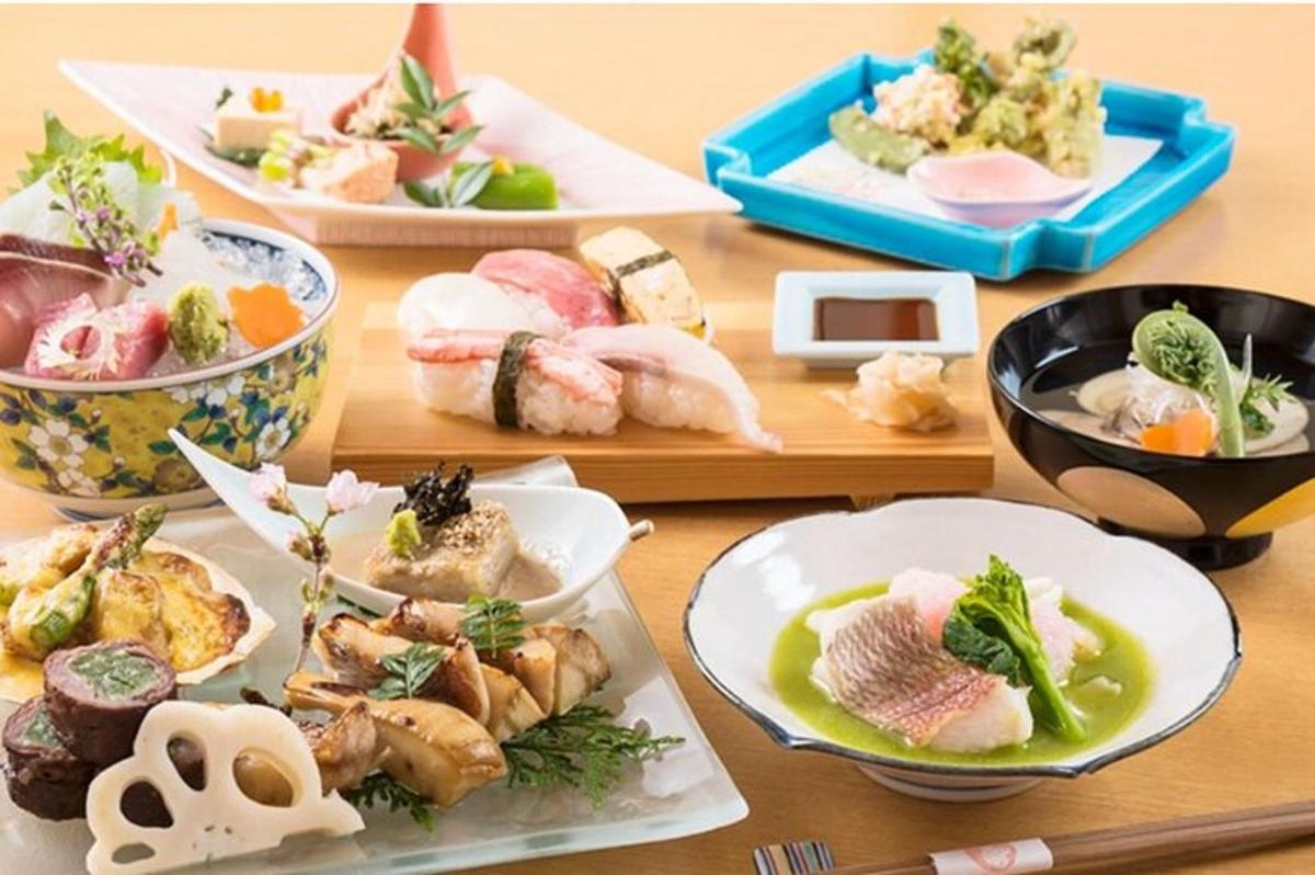 a wooden table with plates of food on it