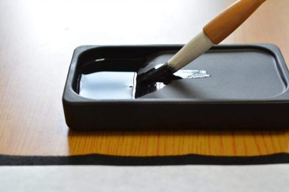 a cigarette sitting on top of a black container