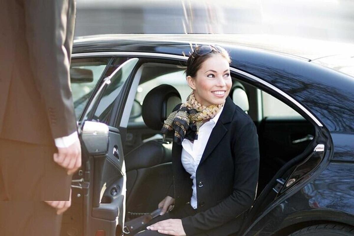 a woman sitting in the back seat of a car