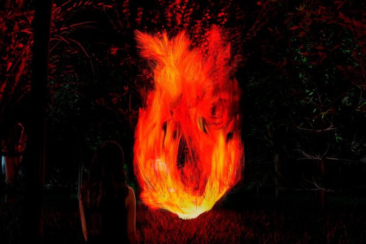a fire ball is lit up in the dark