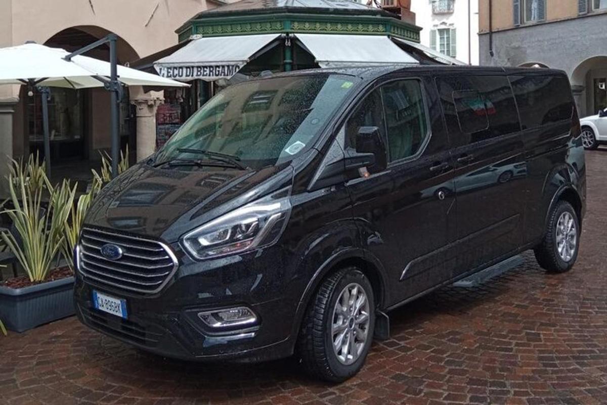a black van parked on a brick street