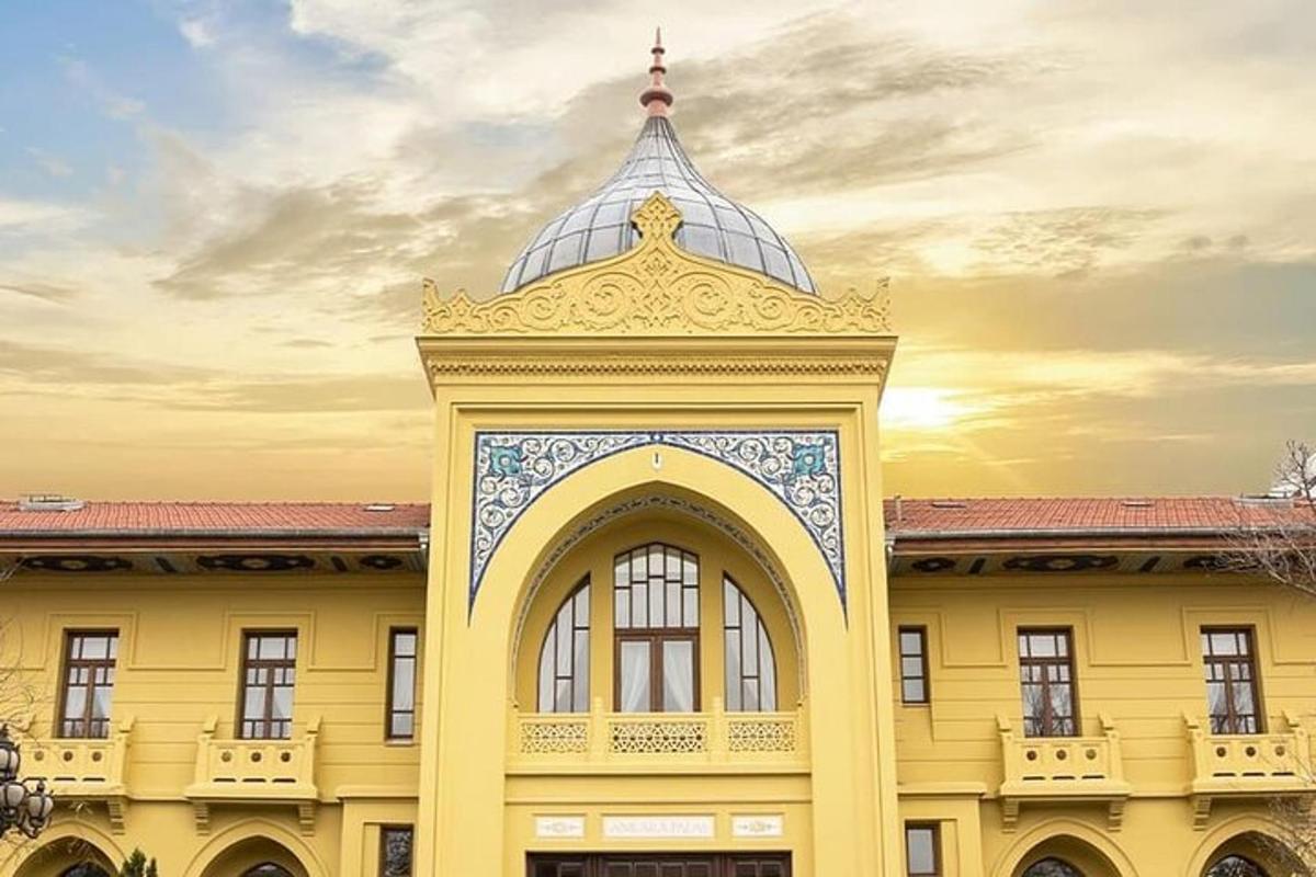 a yellow building with a clock tower on top of it
