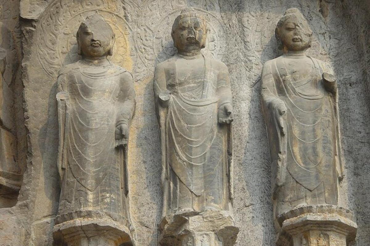 a group of statues on the side of a building