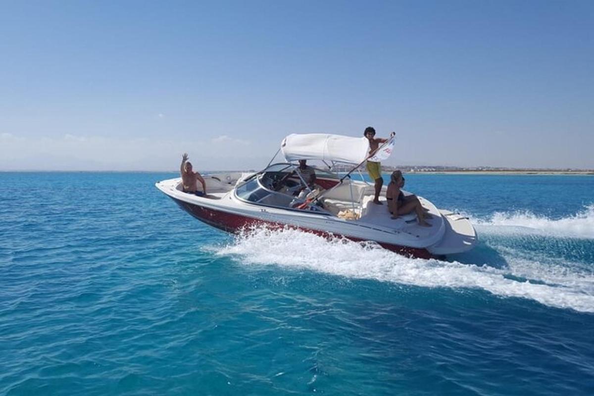 a group of people on a boat in the water
