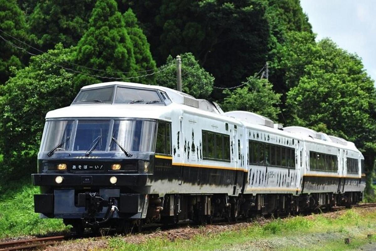 a white train traveling down the tracks