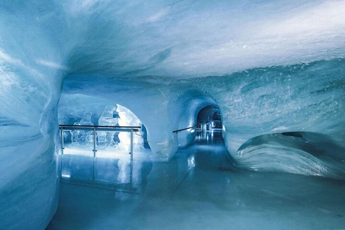 an ice cave with an entrance to a tunnel in an ice cave