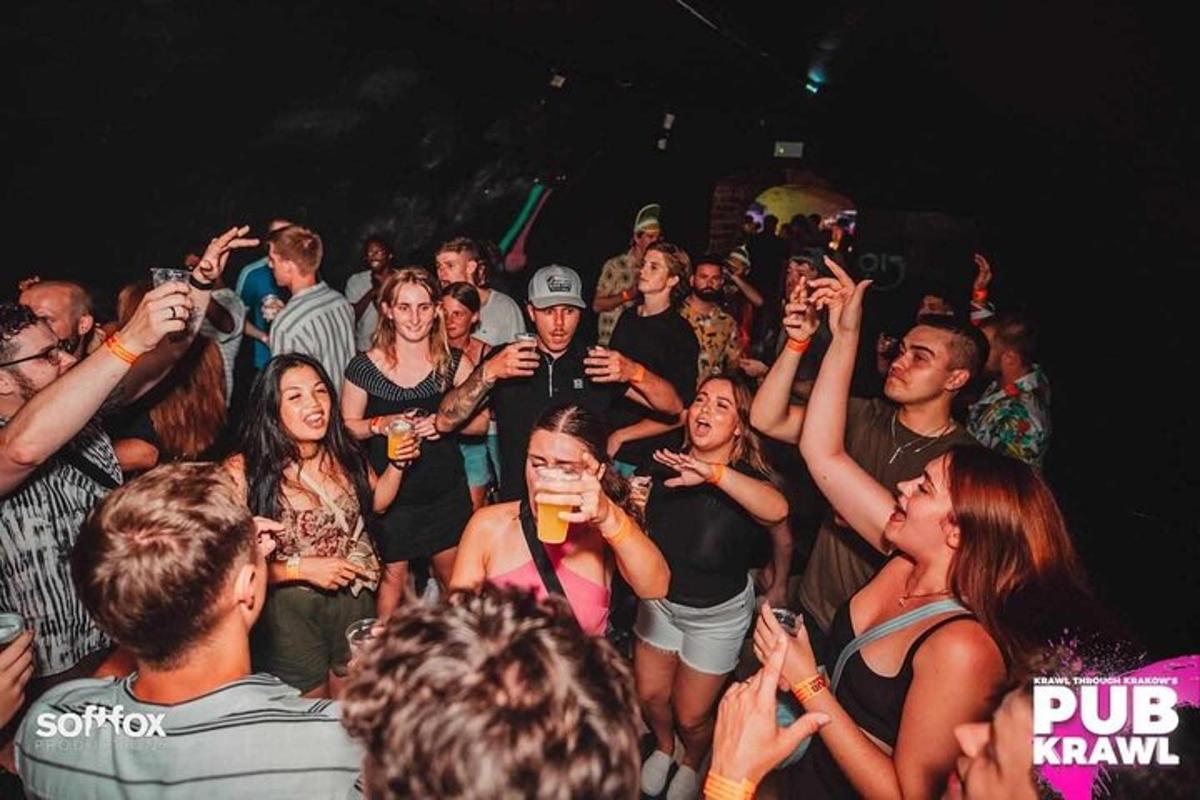 a group of people standing in a crowd at a party