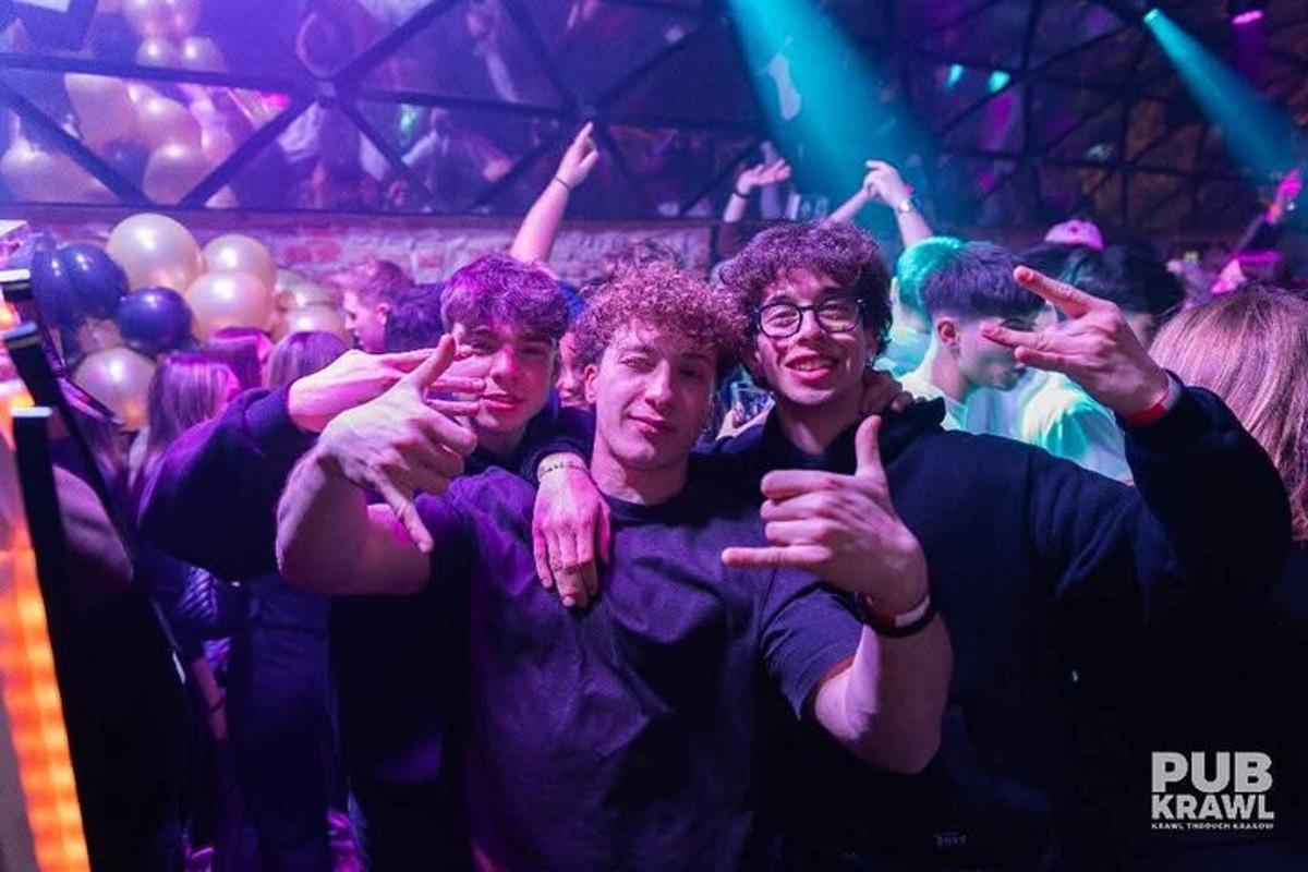 a group of men posing for a picture in a club