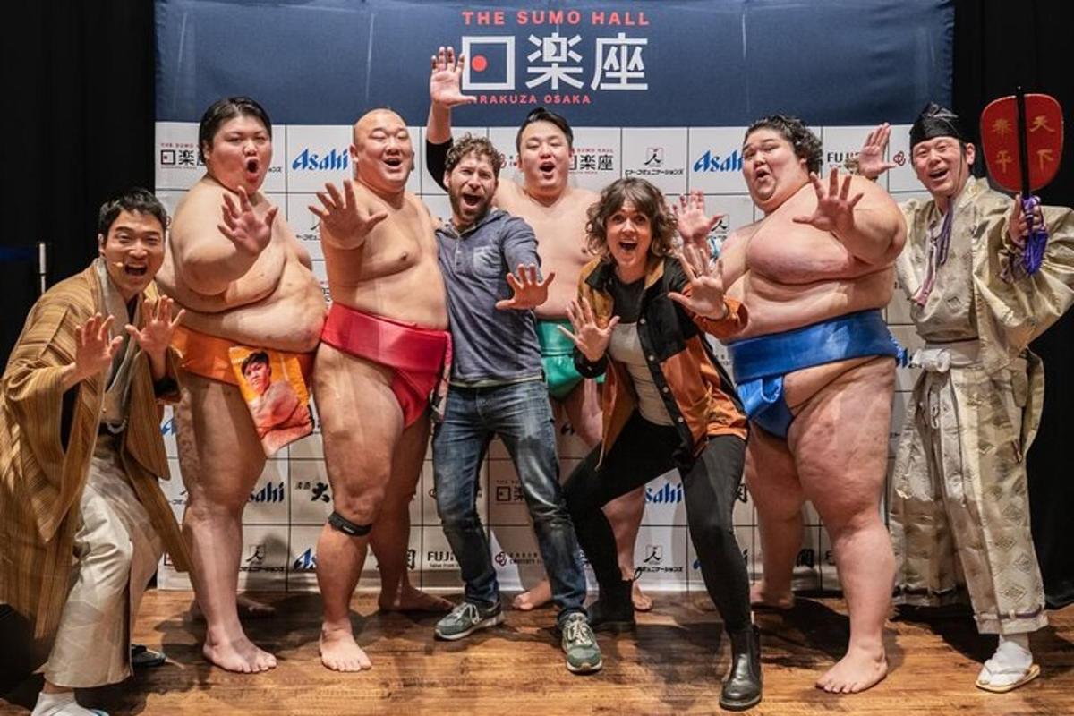 a group of men in skim suits posing for a picture
